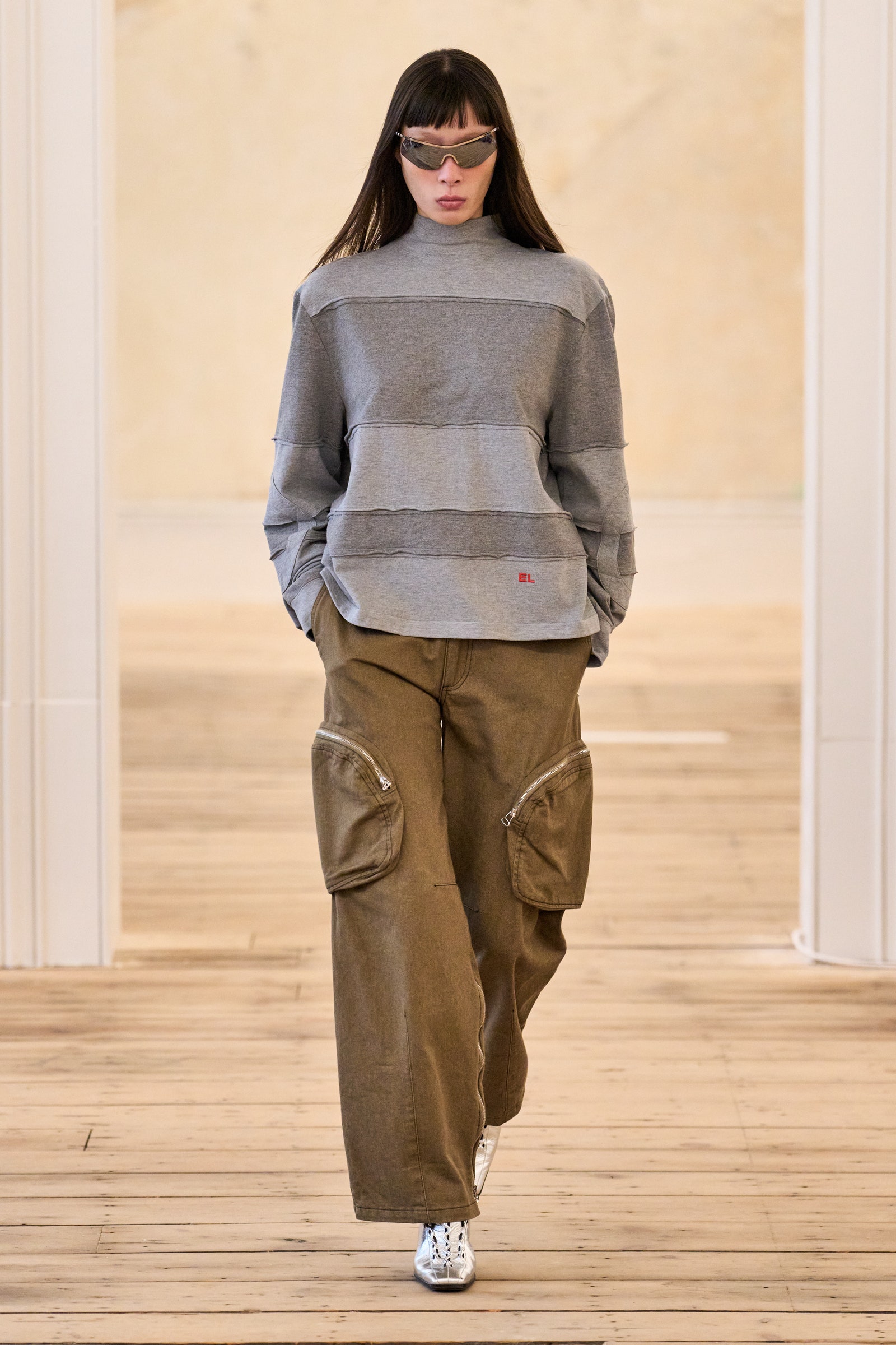 Images may contain Sayoko Yamaguchi clothing pants knitted sweater adults and people