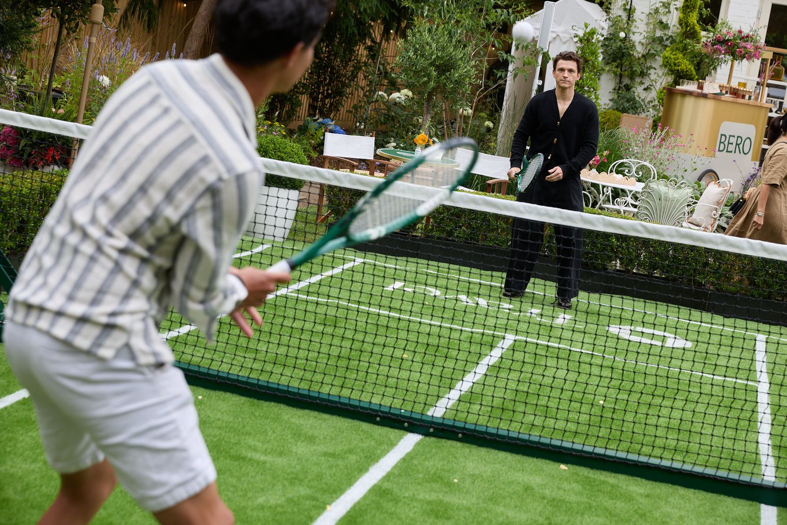 Images may contain Tom Holland adult racket clothing shoes sports tennis rackets and chairs