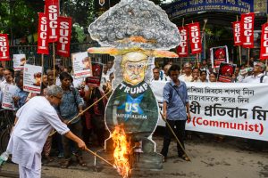 Suci Communist supporters burned a statue of Donald Trump at a protest rally against U.S. President Donald Trump against his recent war attitude towards the Israeli-Palestine conflict in the Israeli-Palestine conflict during his recent observations on Hiroshima Day in Kolkata, India