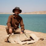 Bekas Brefkany, director of the Antiquities Department of Dohuk, placed next to a tomb on the bank of the Mosul Dam on an archaeological site in the Khanke sub-district of Dohuk Province on August 30, 2025.