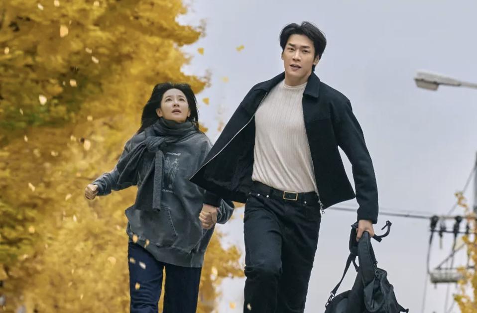 A man and a woman escape from danger.